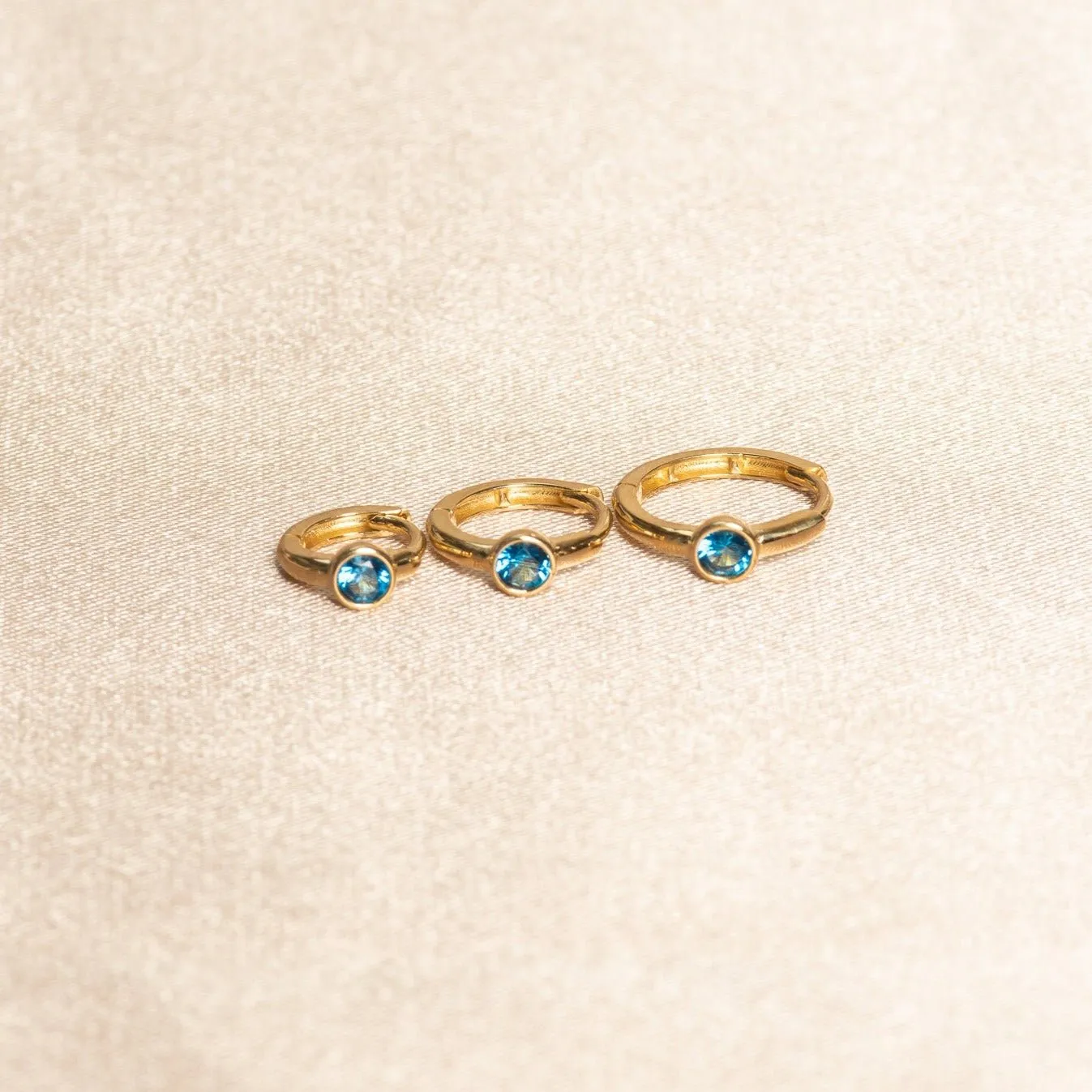 Bezel Set Blue Topaz Huggie in 14k Gold