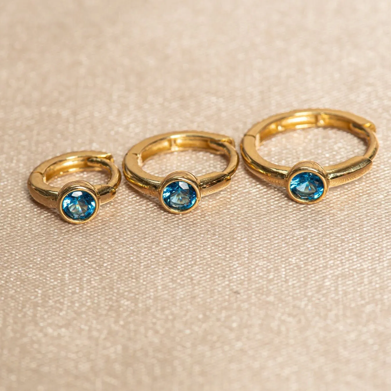 Bezel Set Blue Topaz Huggie in 14k Gold