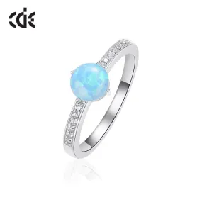 Sterling silver elegant blue opal with little crystals ring