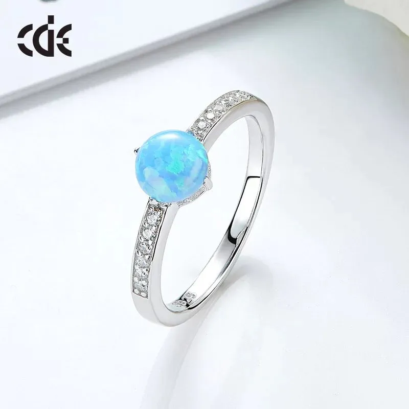 Sterling silver elegant blue opal with little crystals ring